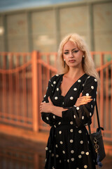 Portrait of a young beautiful blonde girl outdoors.