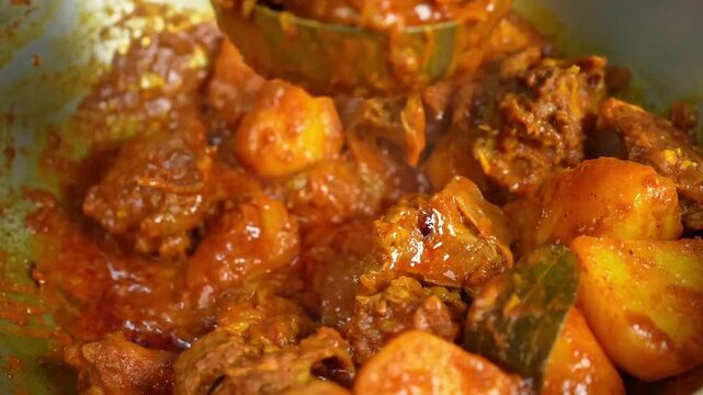 Mutton Curry with potato Cooking in pan close view
