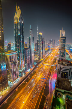 tunning Night time View of Dubai City Skyscrapers and Highways