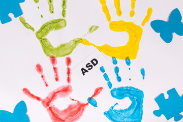 Kids handprint made of paint and inscription ASD. Autism Spectrum Disorder. Autism awareness