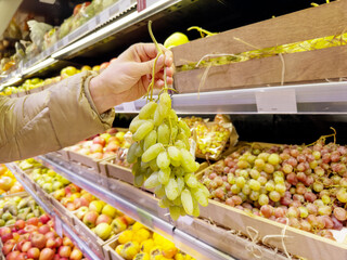 buying fruits (grape) at the market