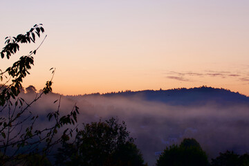 Sunrise over the North Downs, Near Guildford, Surrey, England. Specifically the wooded hills known...