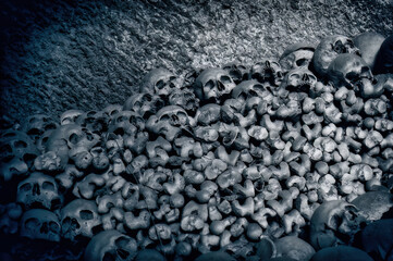 Pile of bones and skulls inside a cave