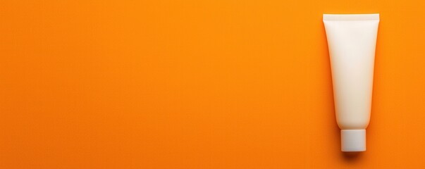 Cosmetic tube, orange isolated background