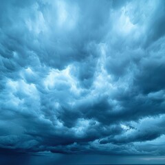 Obraz premium Dramatic blue clouds gathering in a stormy sky, isolated background.