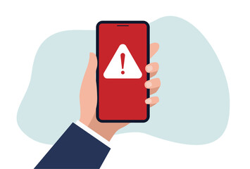 Businessman holding mobile phone with red warning alert system hacked screen. System alert for virus, spam, scam and phishing. Cyber security, data security system concept.