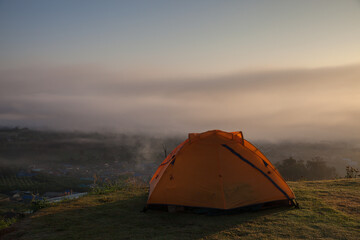 Camping tent on green grass field