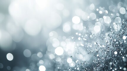 Obraz premium White and Grey Bokeh Lights Blurred Background for Winter Holidays