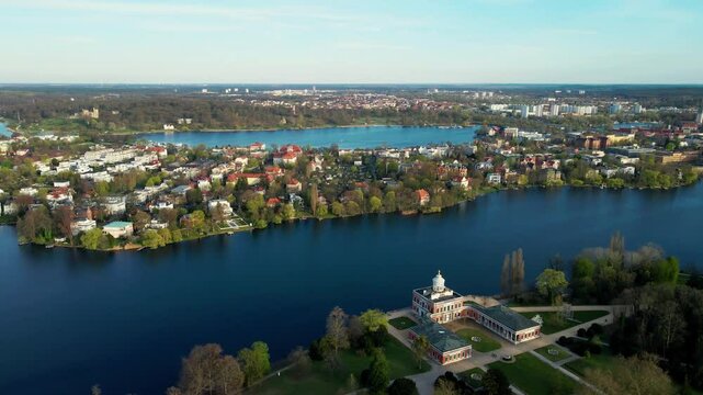 Aerial sink flight of Mamorpalais and lake Heiliger See in Potsdam, Germany