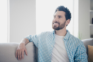 Photo of handsome bearded alone mature age adult man staying home in his new house indoors living...