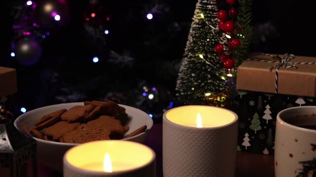 Christmas table with cookies, kako, gifts and candles. New Year's mood