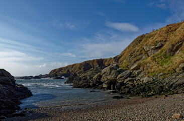 The Entrance and gently shelving Shingle Beach of Old Portlethen Fishing Harbour on the Aberdeenshire Coast of Scotland.