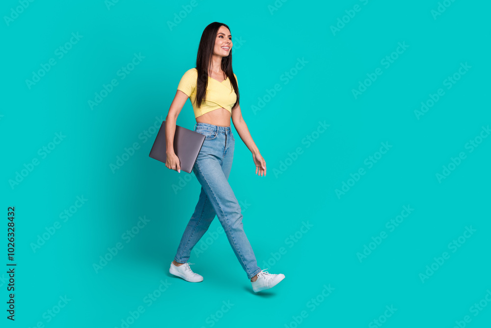 Sticker Full body portrait of nice young woman walk empty space wear top isolated on turquoise color background