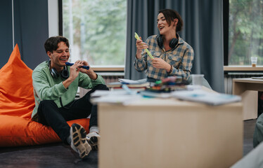 Two college students participate in a lively music class, playing instruments and sharing laughter in a relaxed classroom setting.