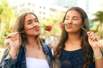 Girl friends, rose and playful for adventure, travel and bonding together in Miami park. Comic,...