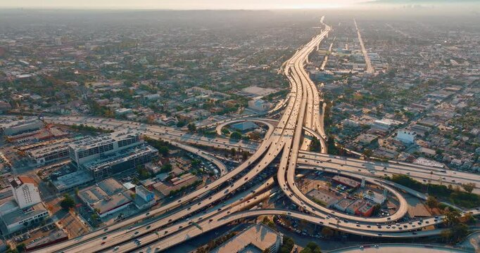Aerial view of the Santa Monica 10 and Harbor 110 freeway interchange at sunrise in downtown Los Angeles. Aerial view.