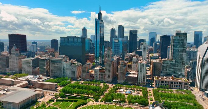 Scenery of beautiful Millennium Park at the lakefront of Chicago. Stunning view of green zone in combination with modern architecture. Aerial view. Sunny summer day.