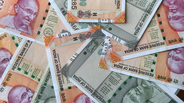 Indian money rotating, Lot of 200 and 500 Indian rupees banknotes, Concept of financial success, lottery or big win. India cash
