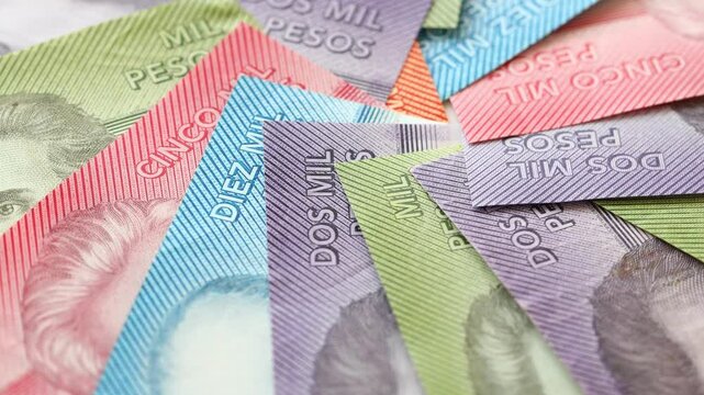 Rotating Chilean money, Lot of Chile pesos. Chile currency, Financial concept, close-up