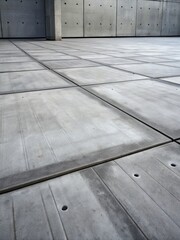 Industrial concrete floor with a grid of clean lines.
