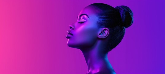 Profile portrait of woman with neon gradient lighting and updo hairstyle