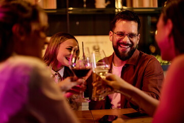 Joyful Friends Celebrating Together at a Cozy Evening Gathering
