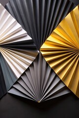 Geometric art with folded black and gold paper.