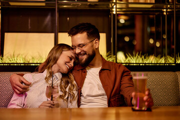Couple Enjoying Relaxing Evening at Cozy Restaurant