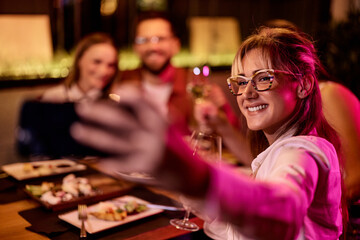 Young Friends Taking a Selfie at a Trendy Restaurant Evening