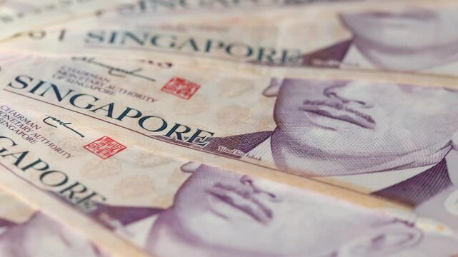 Singapore money rotating, Lot of  dollars banknotes, Singapore currency, Financial concept