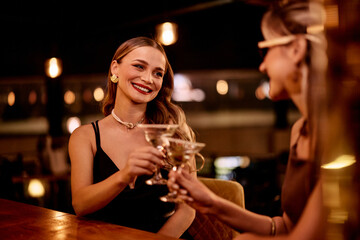 Elegant Women Enjoying Drinks in a Stylish Lounge Bar