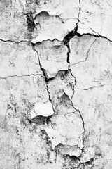 Obraz premium Old stone wall with cracks and fissures, suitable for architectural or distressed background use