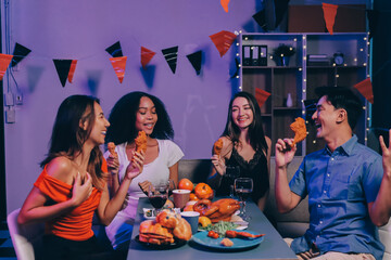 Joyful office Halloween party with coworkers in costumes, celebrating with drinks and laughter, fostering teamwork and festive spirit