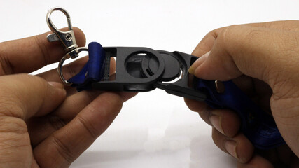 Fototapeta premium The neck lanyard is held by an adult's hand