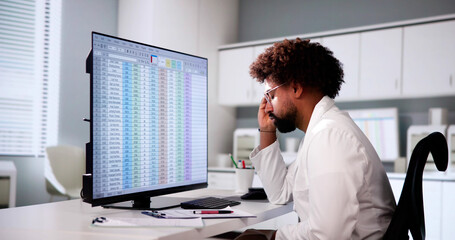 Data Analyst African Man Using Spreadsheet