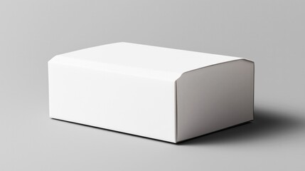 Minimalist image of a plain white rectangular cardboard box on a neutral gray background with soft lighting casting a shadow.