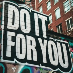Fototapeta premium Word ‘Do it for you’ written in graffiti-style lettering with spray paint effect isolated on transparent background 