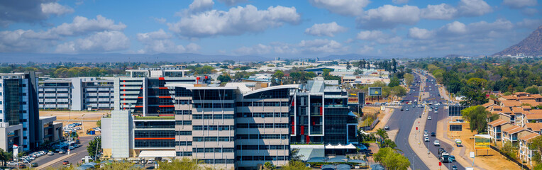 aerial view, Gaborone Botswana, residential and business district, split by main street road, real estate developer ,