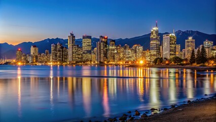 Obraz premium panoramic view of Vancouver skyline at night from Spanish Banks