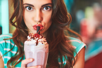 Portrait, shock and woman drinking milkshake at diner for strawberry smoothie, dessert and cold...