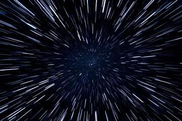 Train&eacute;es lumineuses vues en perspective provenant d'un point central sur fond sombre