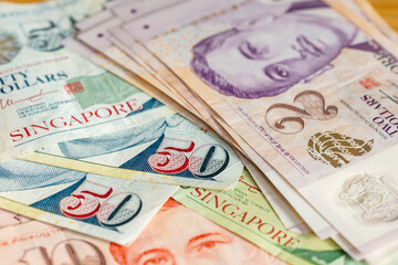 Singapore dollars. Financial business concept. Singapore money lying on the table, close up