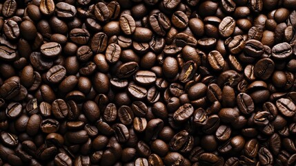 Fototapeta premium Overhead view of backdrop representing halves of dark brown coffee beans with pleasant scent.