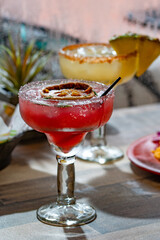 Red margarita cocktail in glass at restaurant