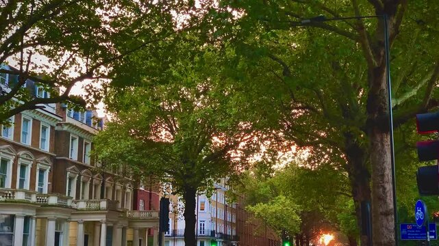 Holland park avenue main street in the city of london england united kingdom europe sunset treelined street british architecture buildings