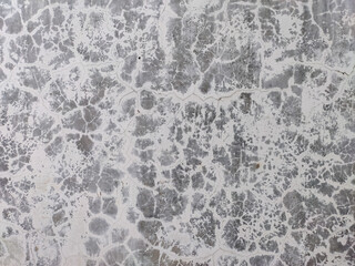 Obraz premium Abstract crack pattern on old wall surface with faded paint.