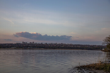 view of the evening city across the river