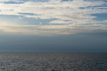 Obraz premium sunset in the cloud over the sea