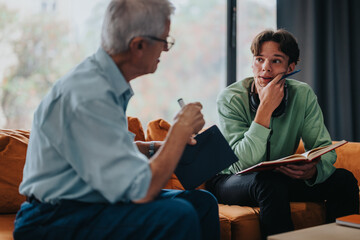 An elderly man engages in a thoughtful conversation with a young student, offering mentorship and...