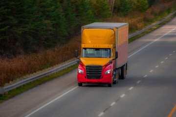 Heavy truck on a Canadian highway in the fall in Quebec